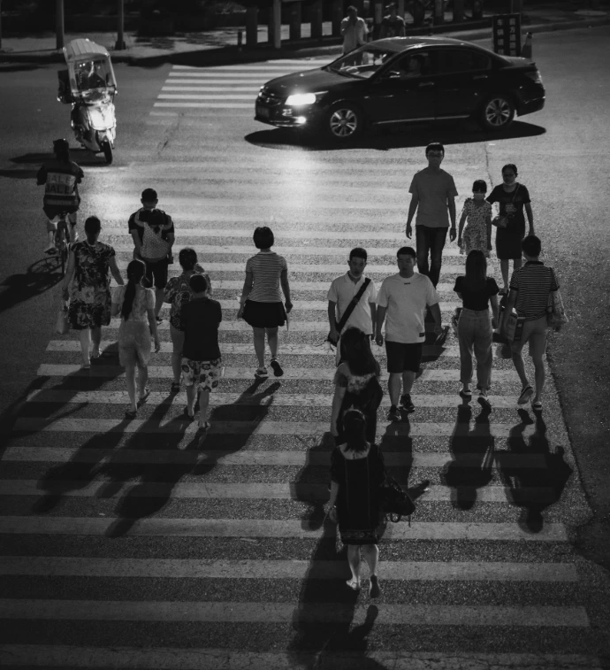 grayscale photo of people walking on street